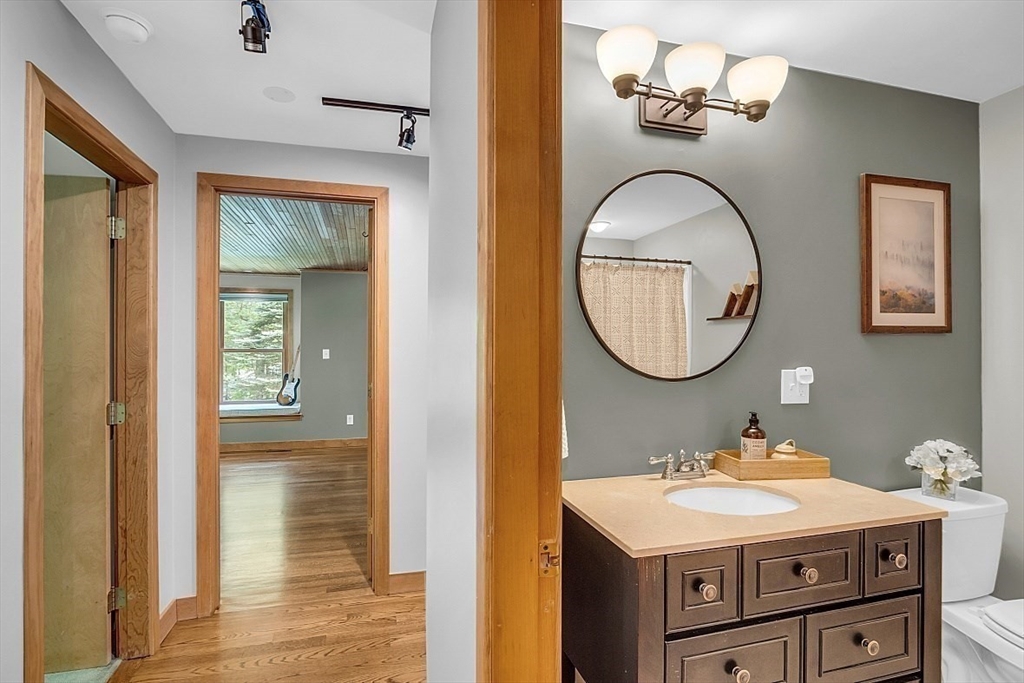 3 Valley Road North Reading, MA 01864 - Photo 17 of 42 a bathroom with a sink a mirror and a shower