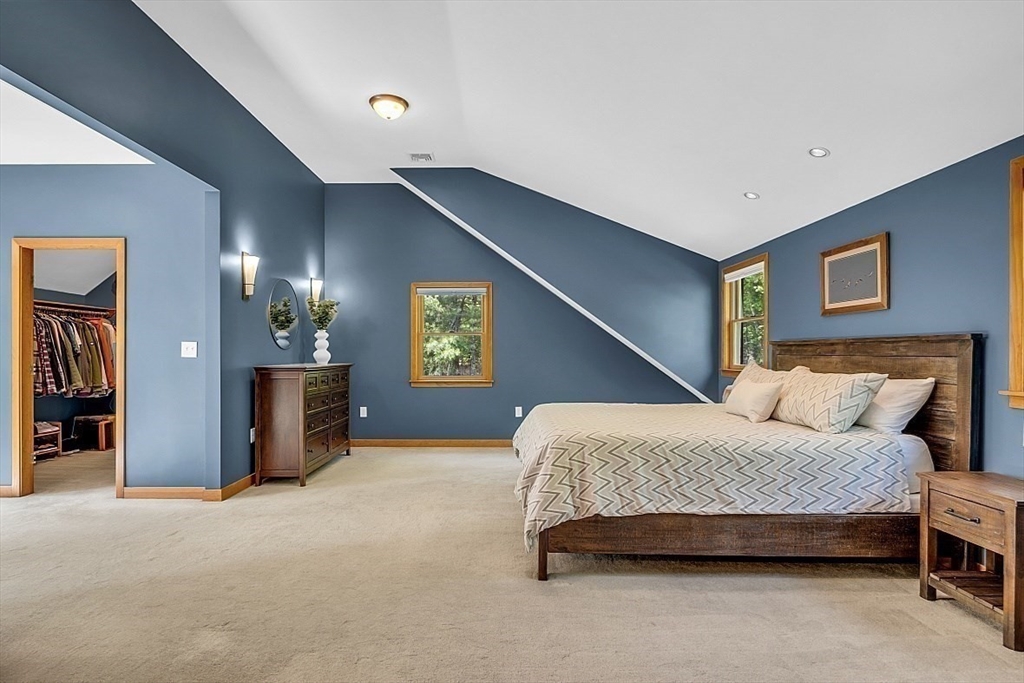 3 Valley Road North Reading, MA 01864 - Photo 20 of 42 a bedroom with a bed and a lamp