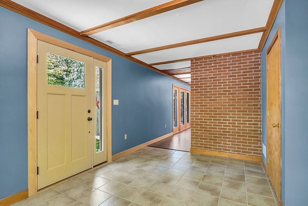 3 Valley Road North Reading, MA 01864 - Photo 2 of 42 a view of a hallway with wooden walls