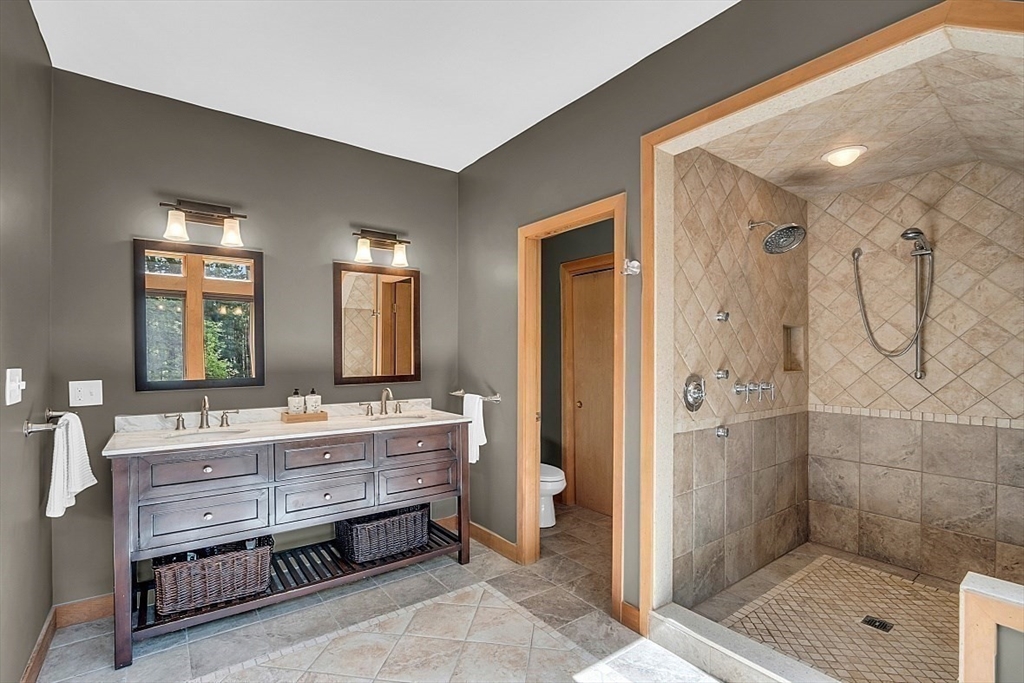 3 Valley Road North Reading, MA 01864 - Photo 21 of 42 a bathroom with a double vanity sink mirror and shower