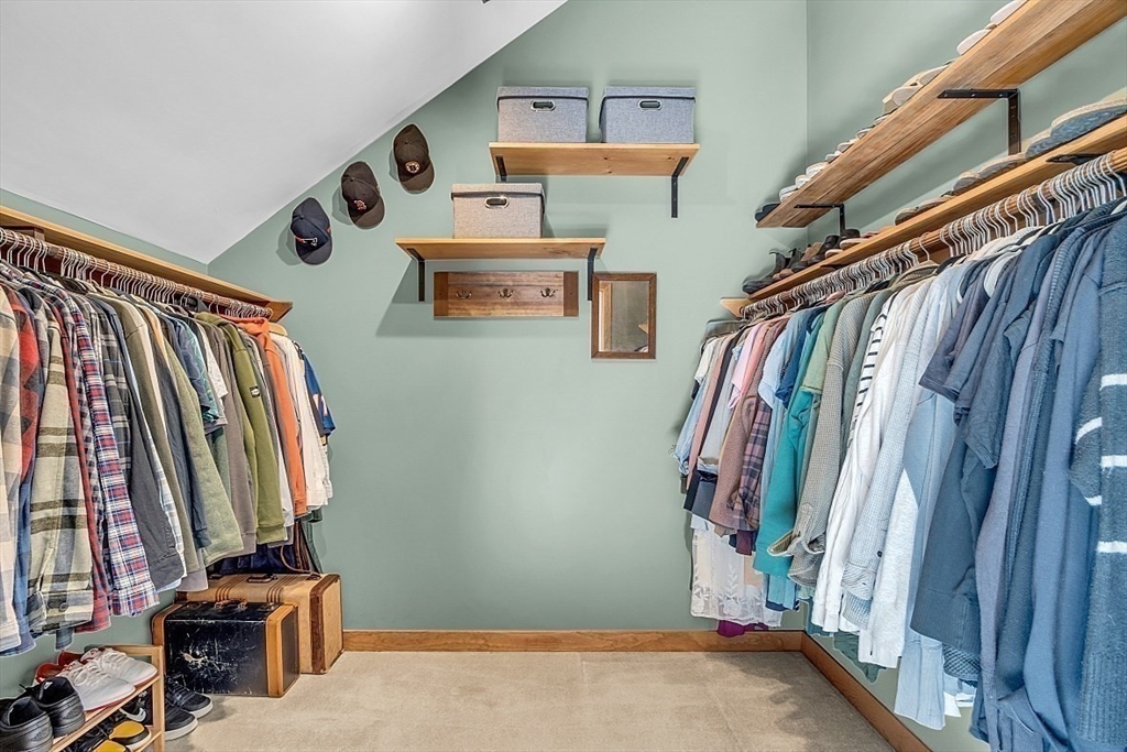 3 Valley Road North Reading, MA 01864 - Photo 24 of 42 a view of walk in closet with clothes and shoes