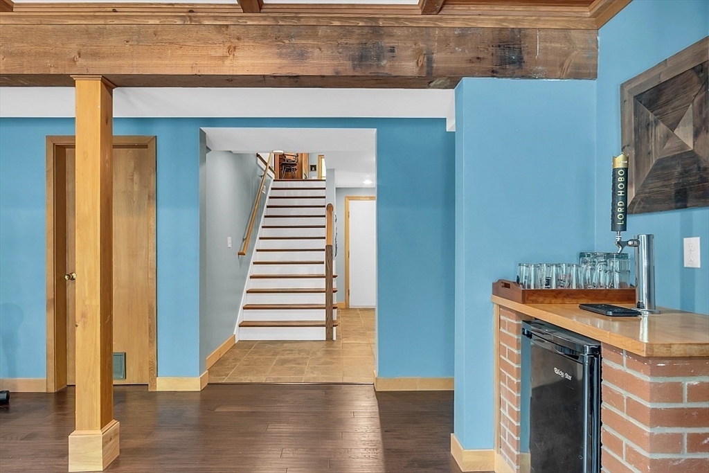 3 Valley Road North Reading, MA 01864 - Photo 3 of 42 a hallway with wooden floor and staircase