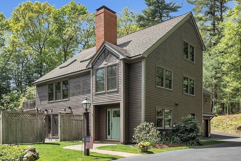 3 Valley Road North Reading, MA 01864 - Photo 38 of 42 a front view of a house with garden