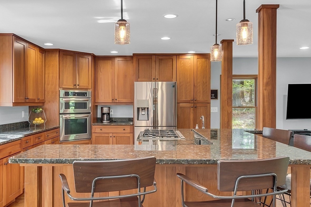 3 Valley Road North Reading, MA 01864 - Photo 6 of 42 a kitchen with kitchen island granite countertop a sink and counter space
