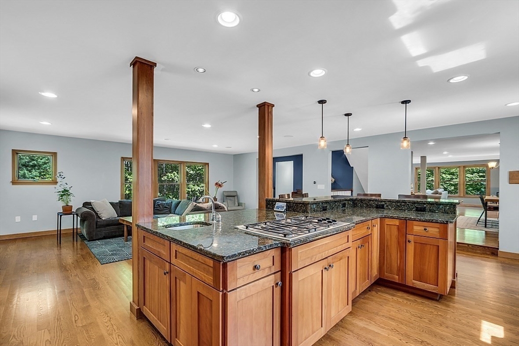 3 Valley Road North Reading, MA 01864 - Photo 7 of 42 a kitchen with stainless steel appliances granite countertop a sink a stove and a wooden floors