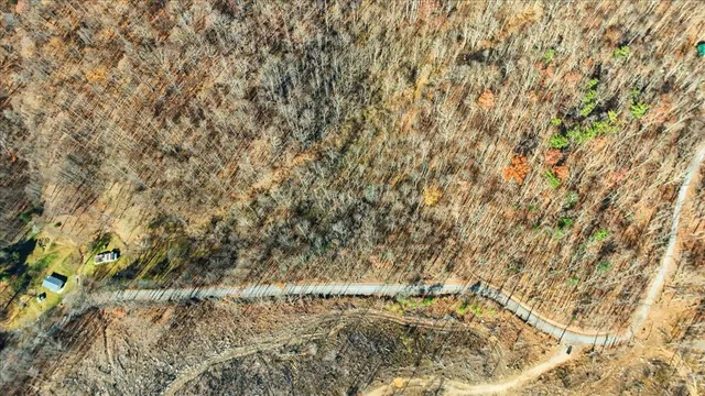 a view of mountain view with trees in the background