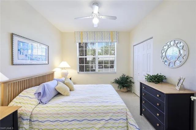 a bedroom with bed and a window