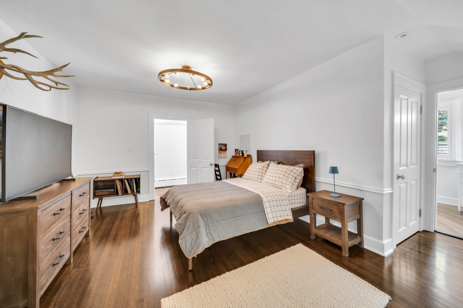 32 Otis Road Barrington Hills, IL 60010 - Photo 27 of 48 a bedroom with a bed and wooden floor