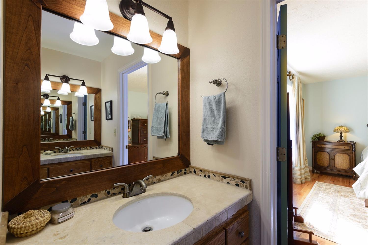 60030 Navajo Road Bend, OR 97702 - Photo 12 of 20 a en suite bathroom with a sink and a mirror