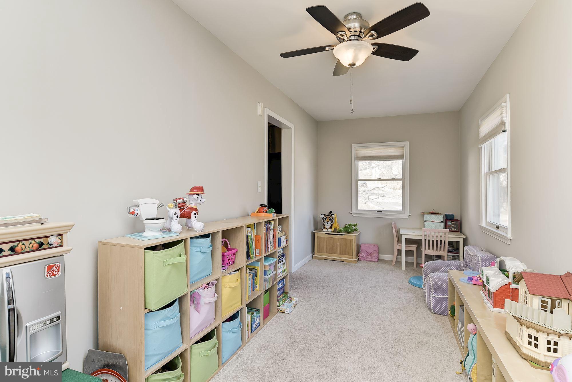 6318 Banbury Road Baltimore, MD 21212 - Photo 13 of 30 a bedroom with furniture a baby crib and a window