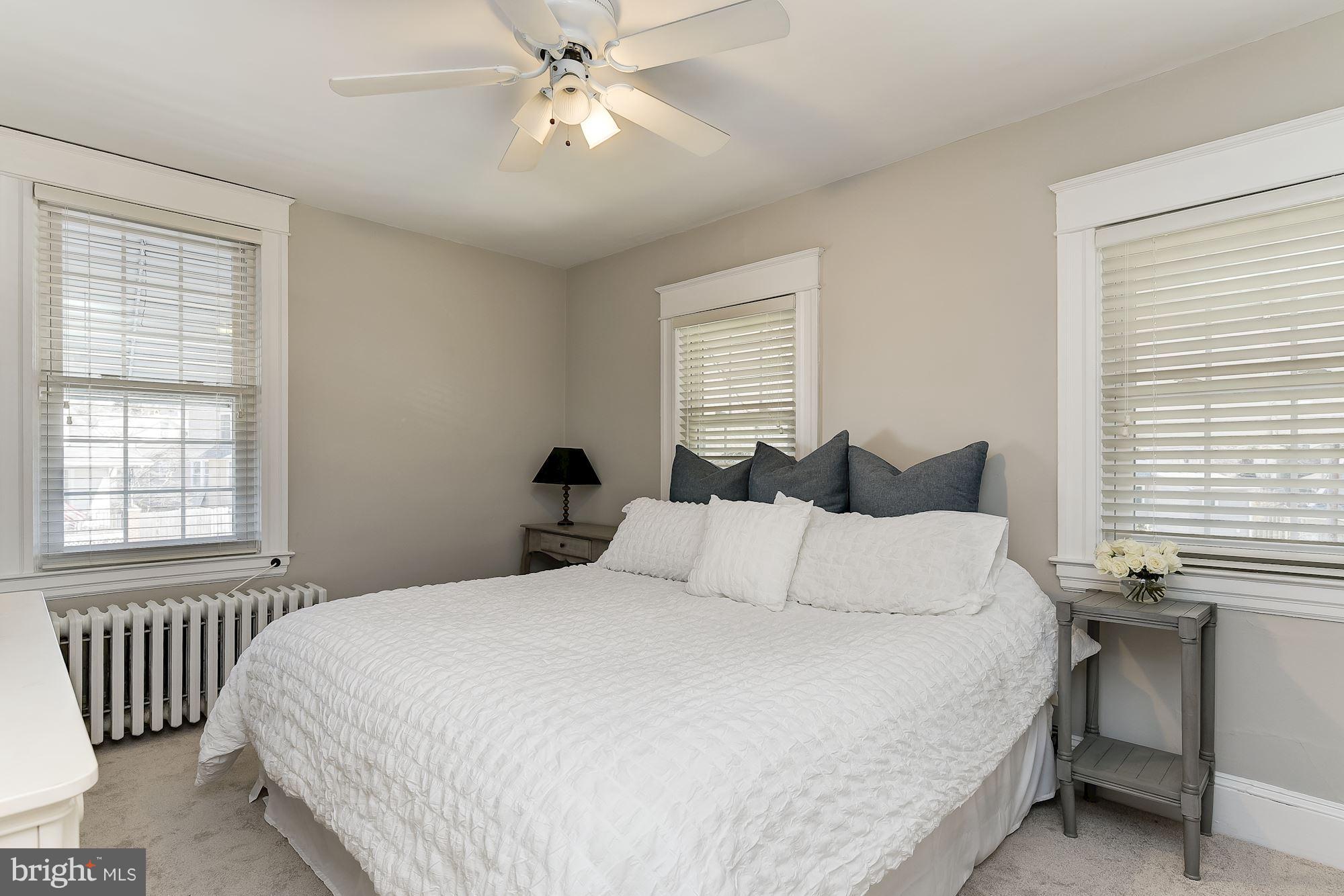 6318 Banbury Road Baltimore, MD 21212 - Photo 17 of 30 a bedroom with a large bed and a window