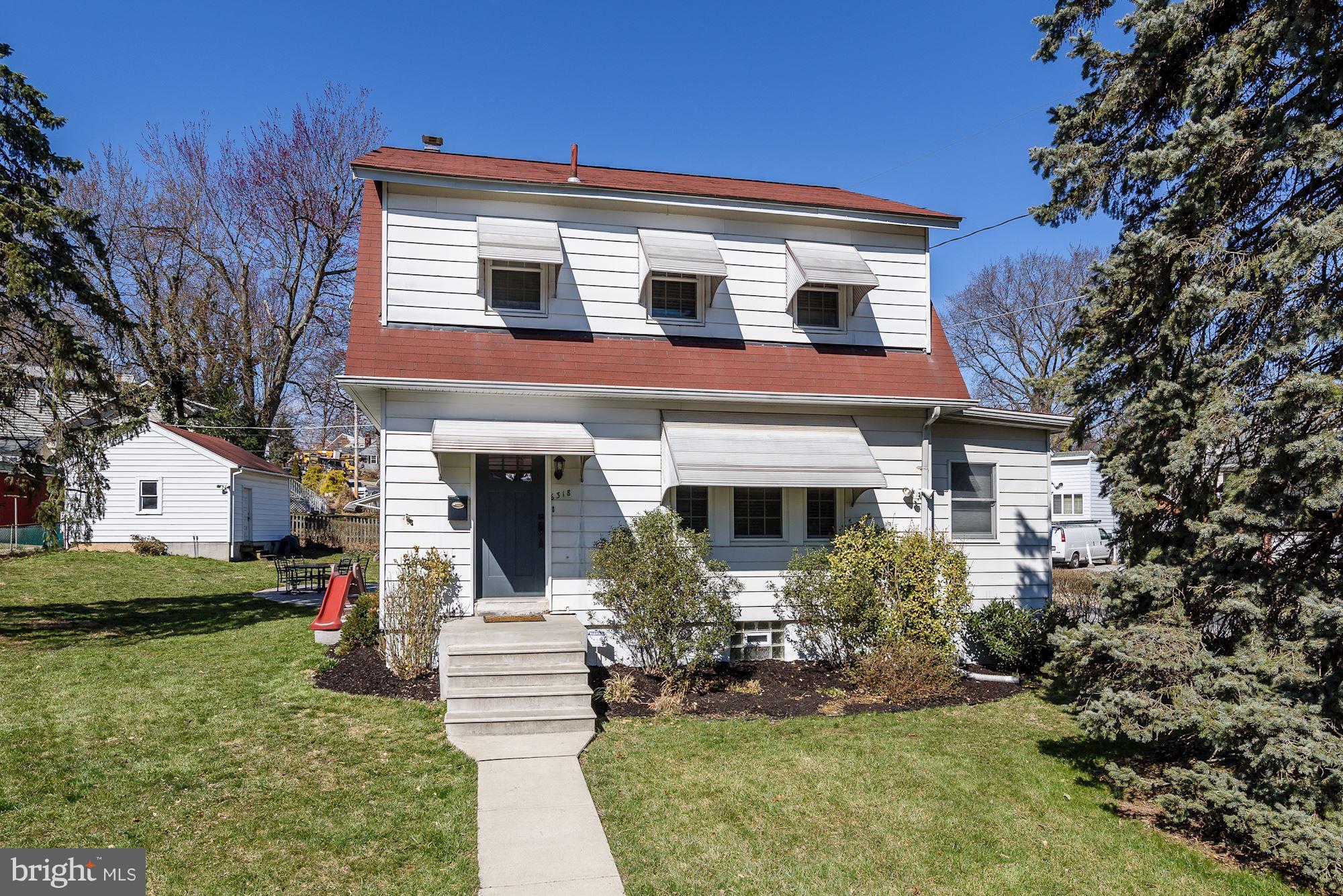 6318 Banbury Road Baltimore, MD 21212 - Photo 3 of 30 a front view of a house with a yard