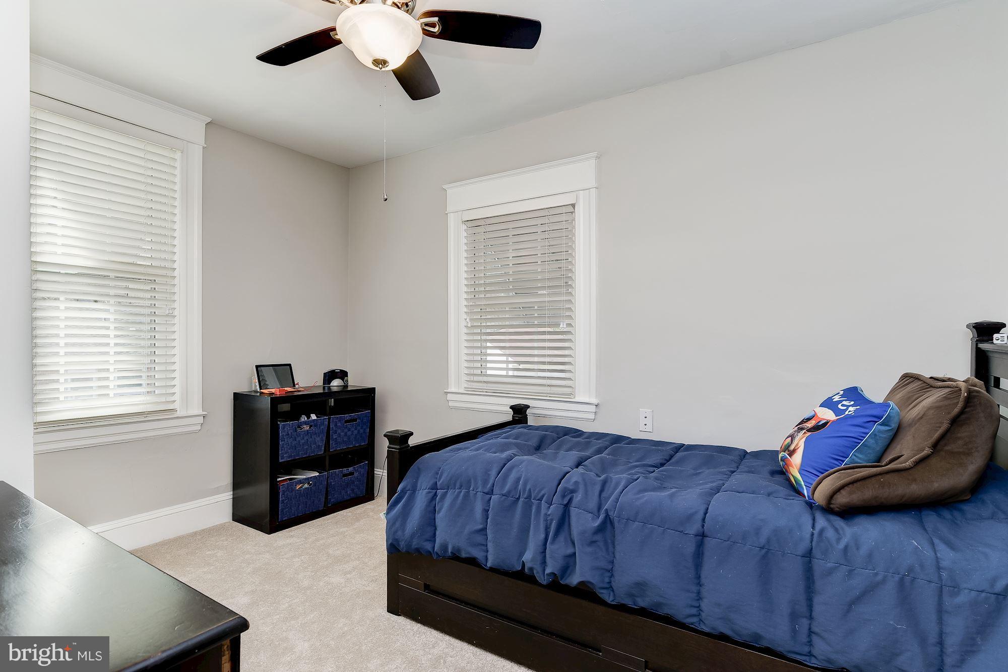 6318 Banbury Road Baltimore, MD 21212 - Photo 22 of 30 a bedroom with a bed and window