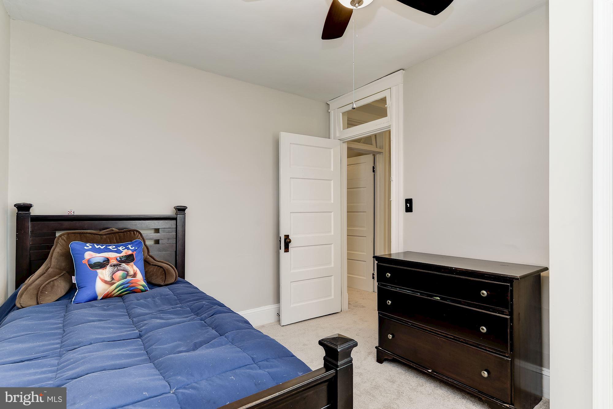 6318 Banbury Road Baltimore, MD 21212 - Photo 23 of 30 a bedroom with a bed and furniture