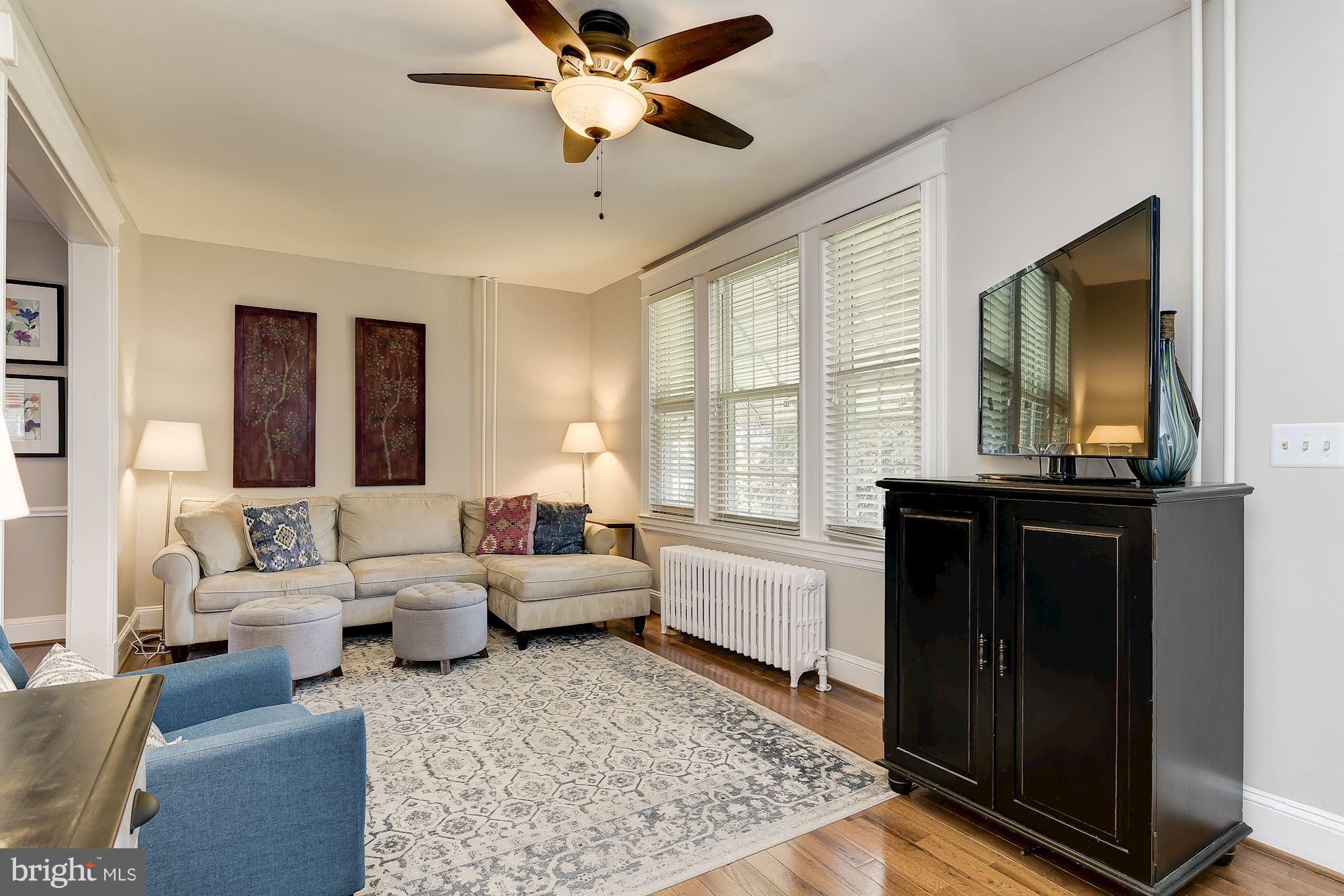 6318 Banbury Road Baltimore, MD 21212 - Photo 6 of 30 a living room with furniture and a flat screen tv