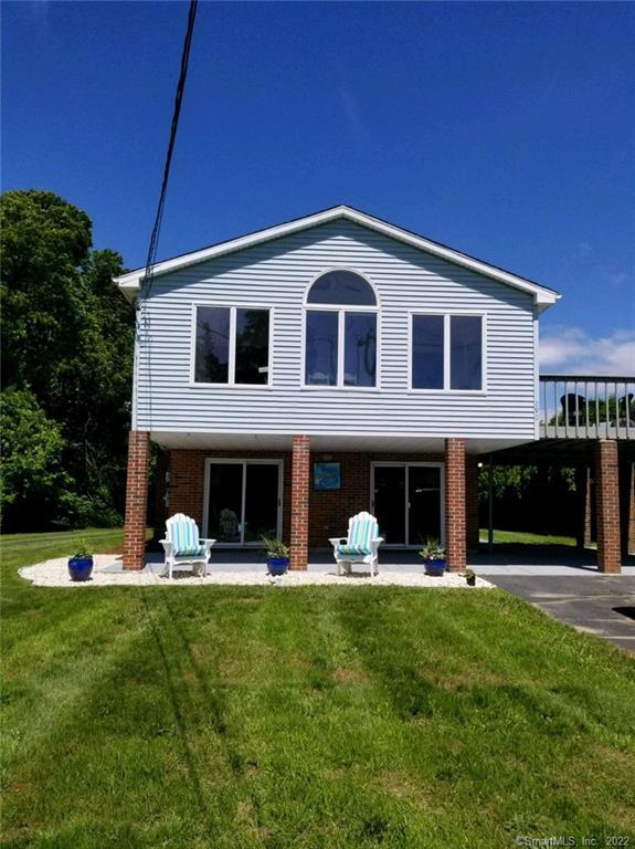 290 Millstone Rd No 1 Waterford, CT 06385 - Photo 1 of 1 a view of a house with a yard porch and sitting area
