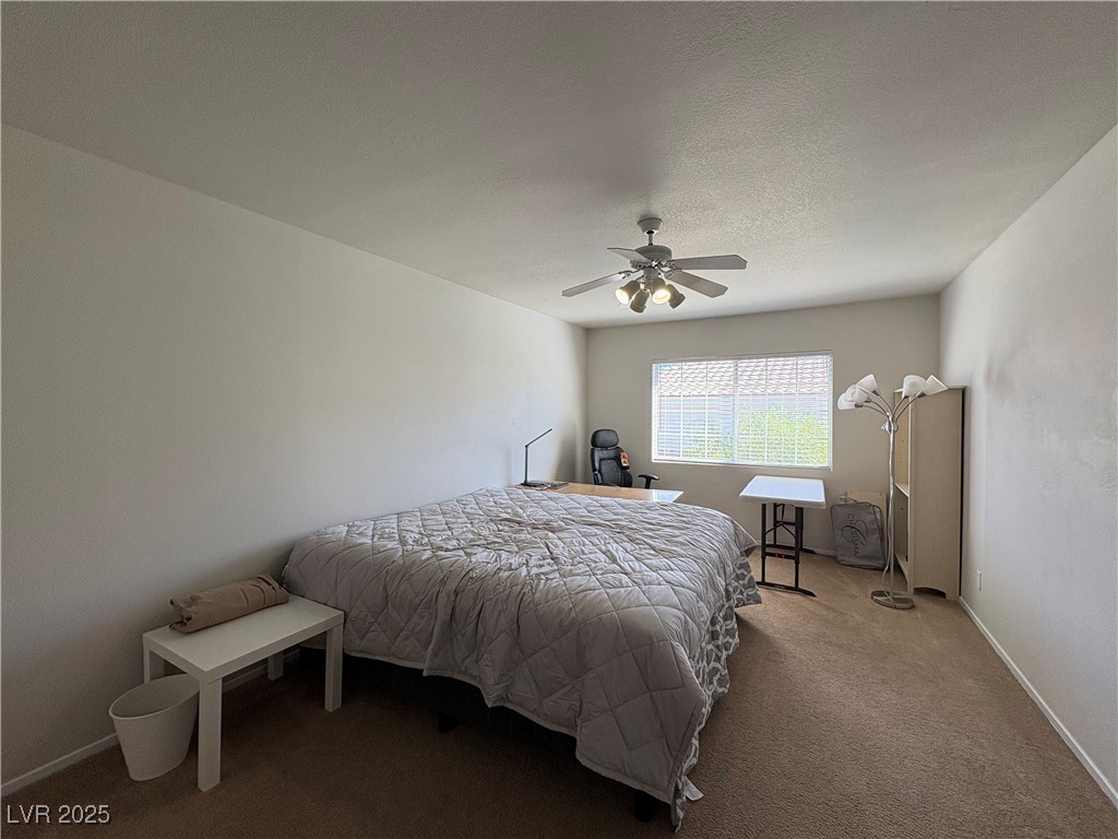 7931 Trea Avenue Las Vegas, NV 89147 - Photo 13 of 25 Bedroom with carpet floors and a ceiling fan
