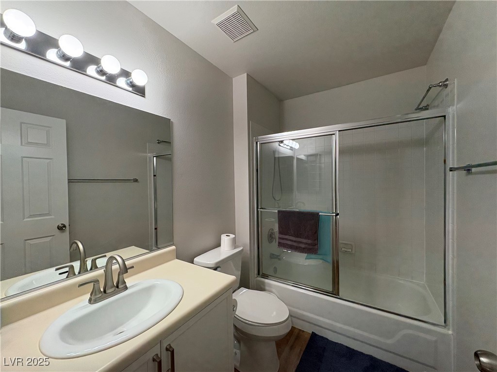 7931 Trea Avenue Las Vegas, NV 89147 - Photo 22 of 25 Full bathroom featuring vanity and shower / bath combination with glass door
