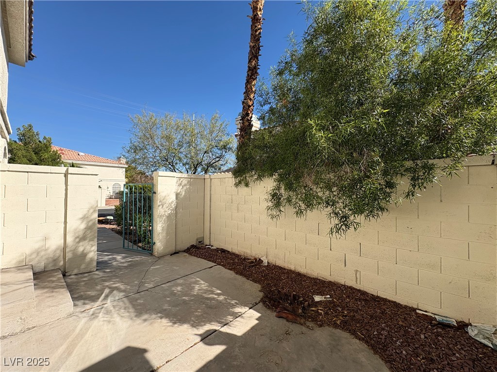 7931 Trea Avenue Las Vegas, NV 89147 - Photo 23 of 25 View of patio / terrace featuring a gate