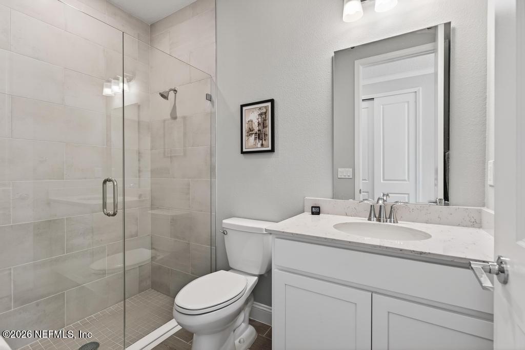 75263 Weathersford Place Yulee, FL 32097 - Photo 23 of 80 a bathroom with a sink toilet and shower