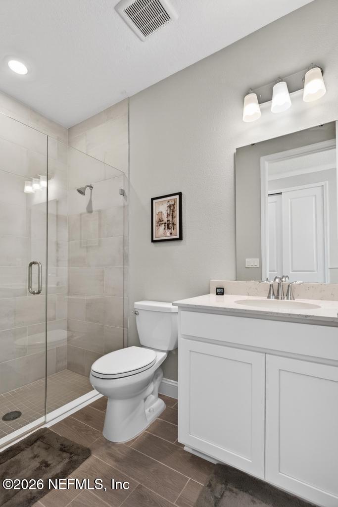 75263 Weathersford Place Yulee, FL 32097 - Photo 24 of 80 a bathroom with a sink toilet and shower