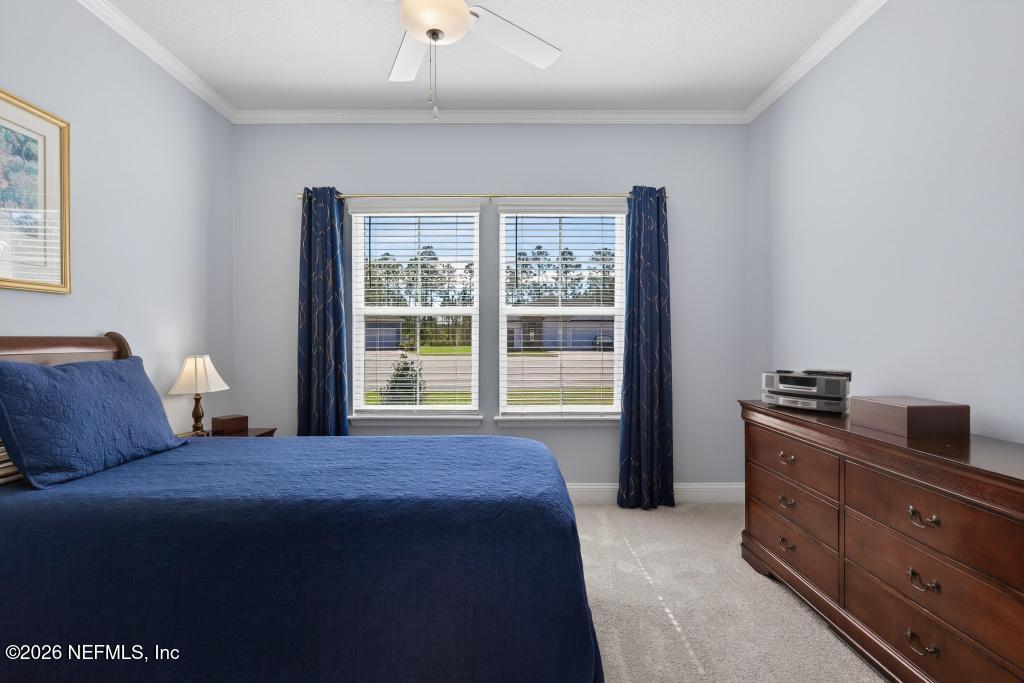 75263 Weathersford Place Yulee, FL 32097 - Photo 25 of 80 a bedroom with a bed and wooden floor