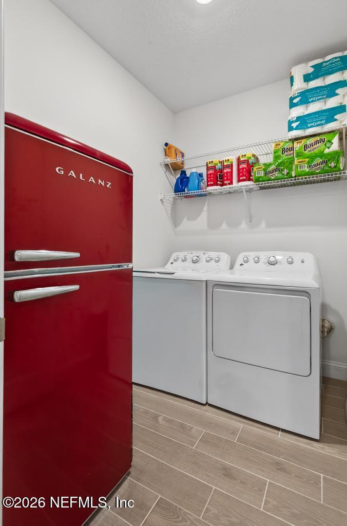 75263 Weathersford Place Yulee, FL 32097 - Photo 33 of 80 a utility room with dryer and washer