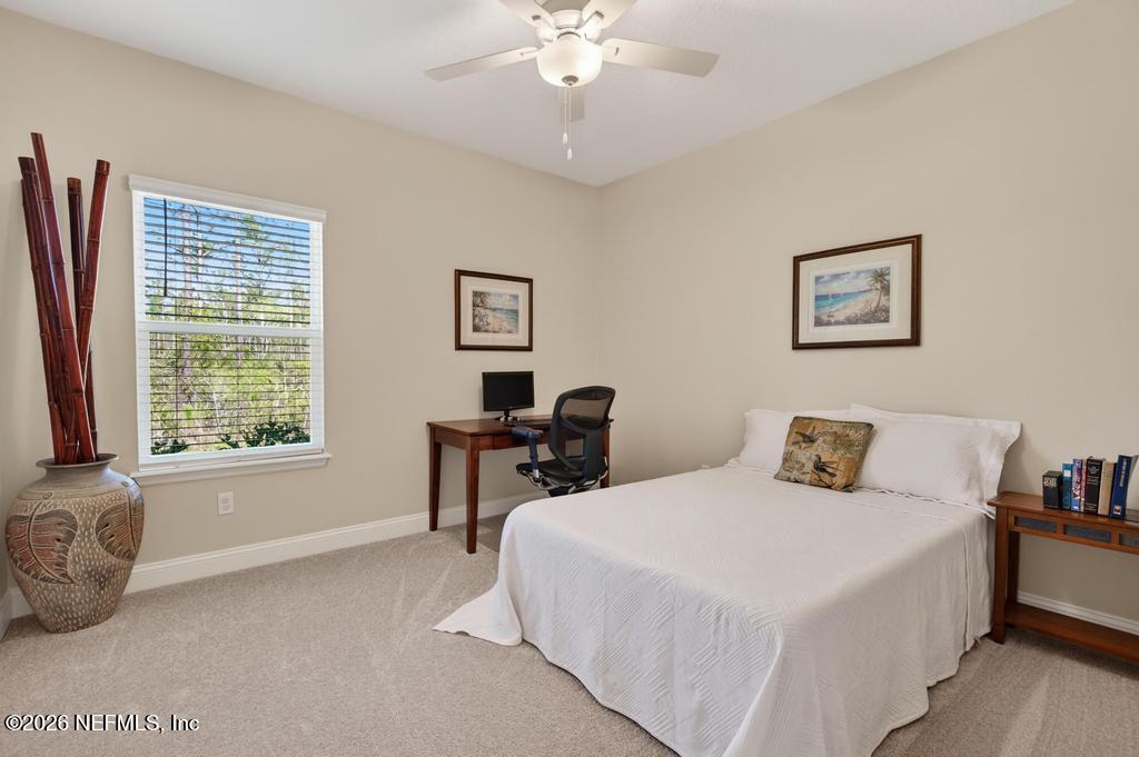 75263 Weathersford Place Yulee, FL 32097 - Photo 37 of 80 a bedroom with a bed and a window