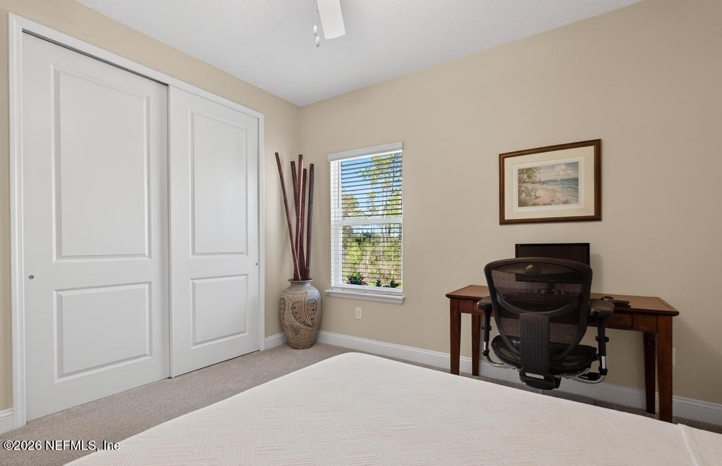 75263 Weathersford Place Yulee, FL 32097 - Photo 38 of 80 a bedroom with a bed and a window