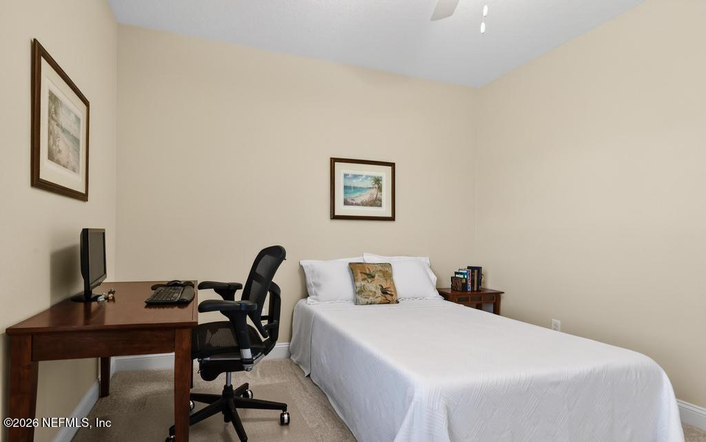 75263 Weathersford Place Yulee, FL 32097 - Photo 39 of 80 a bedroom with a bed and a desk
