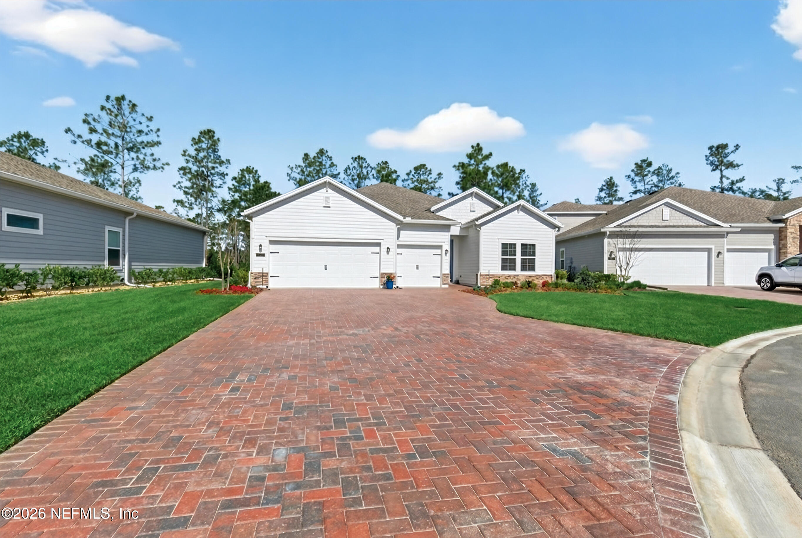 75263 Weathersford Place Yulee, FL 32097 - Photo 4 of 80 a view of house with a yard and potted plants