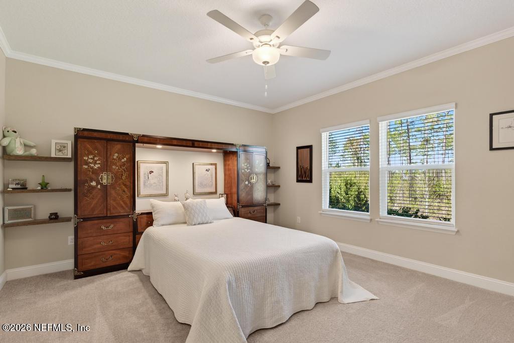 75263 Weathersford Place Yulee, FL 32097 - Photo 45 of 80 a bedroom with a bed and a large window with the outer view