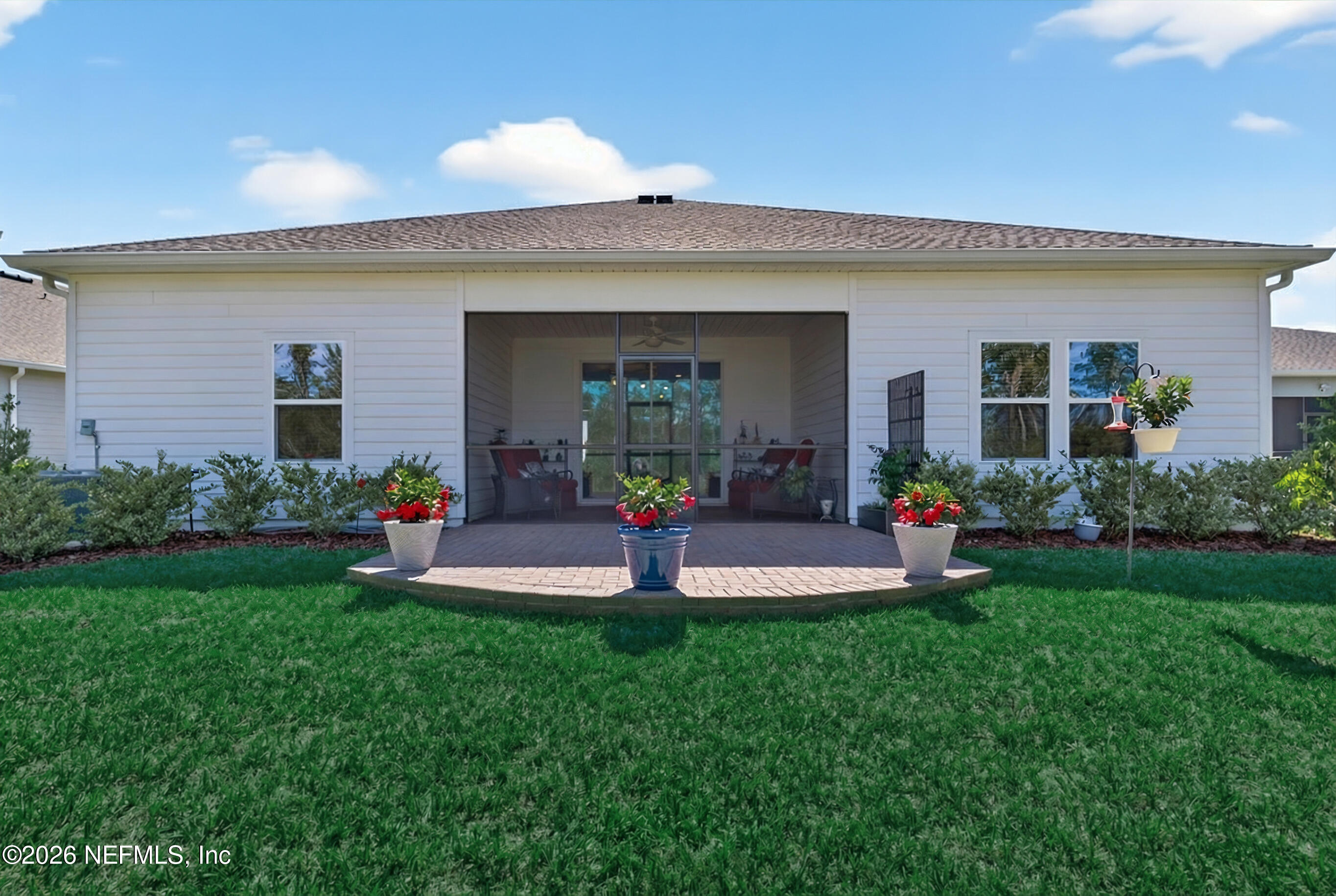 75263 Weathersford Place Yulee, FL 32097 - Photo 60 of 80 a view of a house with backyard and sitting area