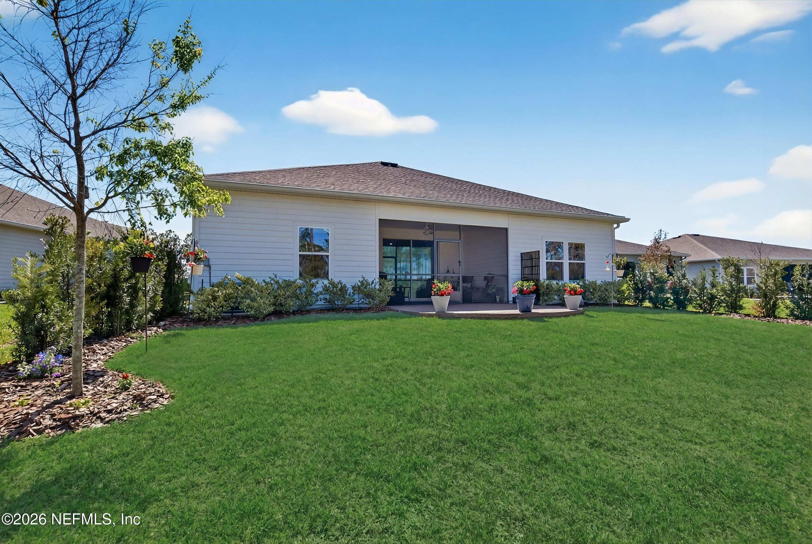 75263 Weathersford Place Yulee, FL 32097 - Photo 63 of 80 a view of an house with backyard space and garden