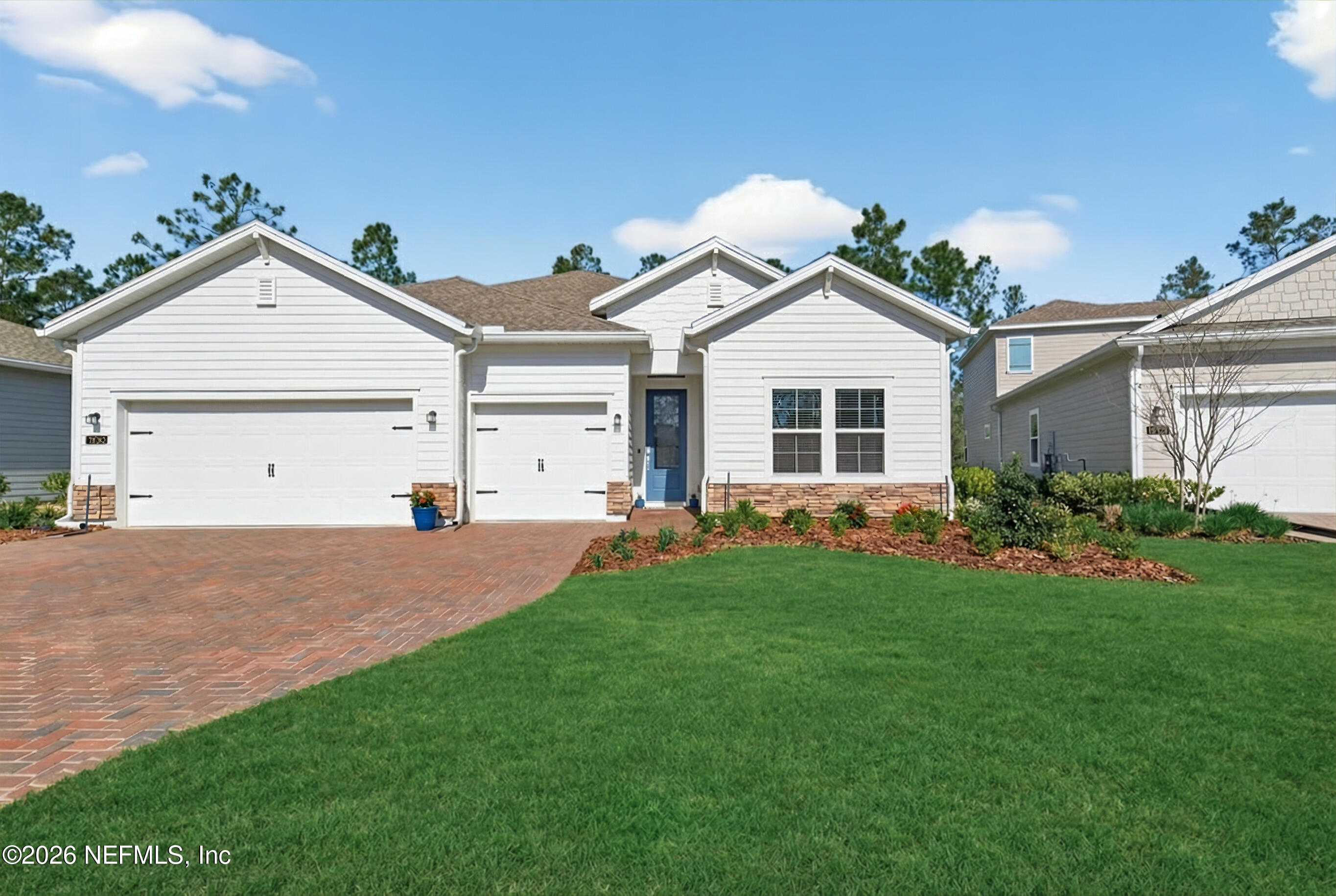 75263 Weathersford Place Yulee, FL 32097 - Photo 7 of 80 a view of a house with backyard and garden