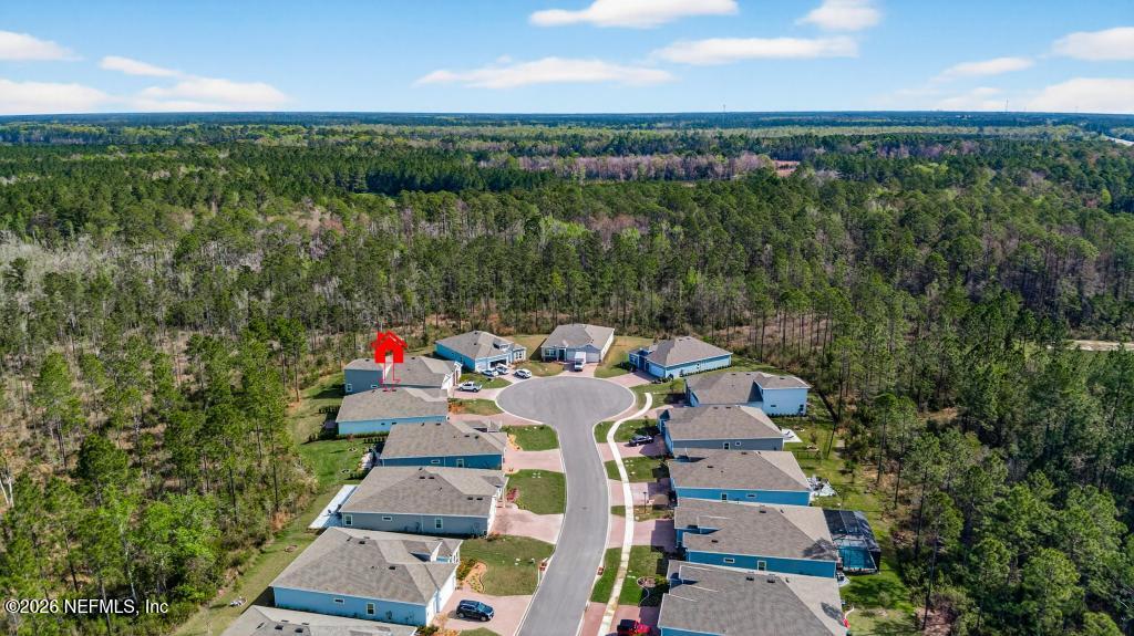 75263 Weathersford Place Yulee, FL 32097 - Photo 71 of 80 a picture of city view with sitting space and garden
