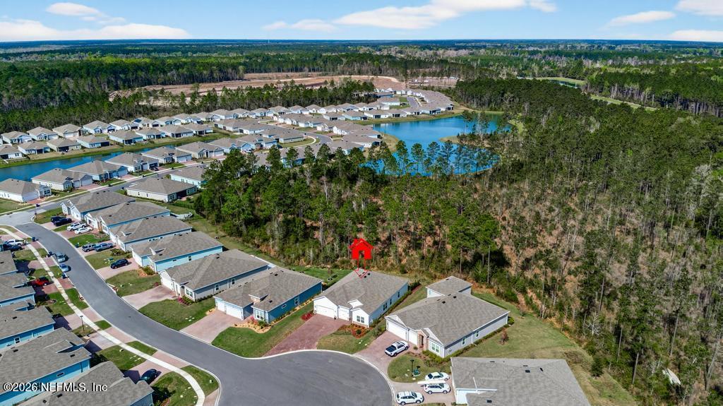 75263 Weathersford Place Yulee, FL 32097 - Photo 76 of 80 an aerial view of residential houses with outdoor space and river