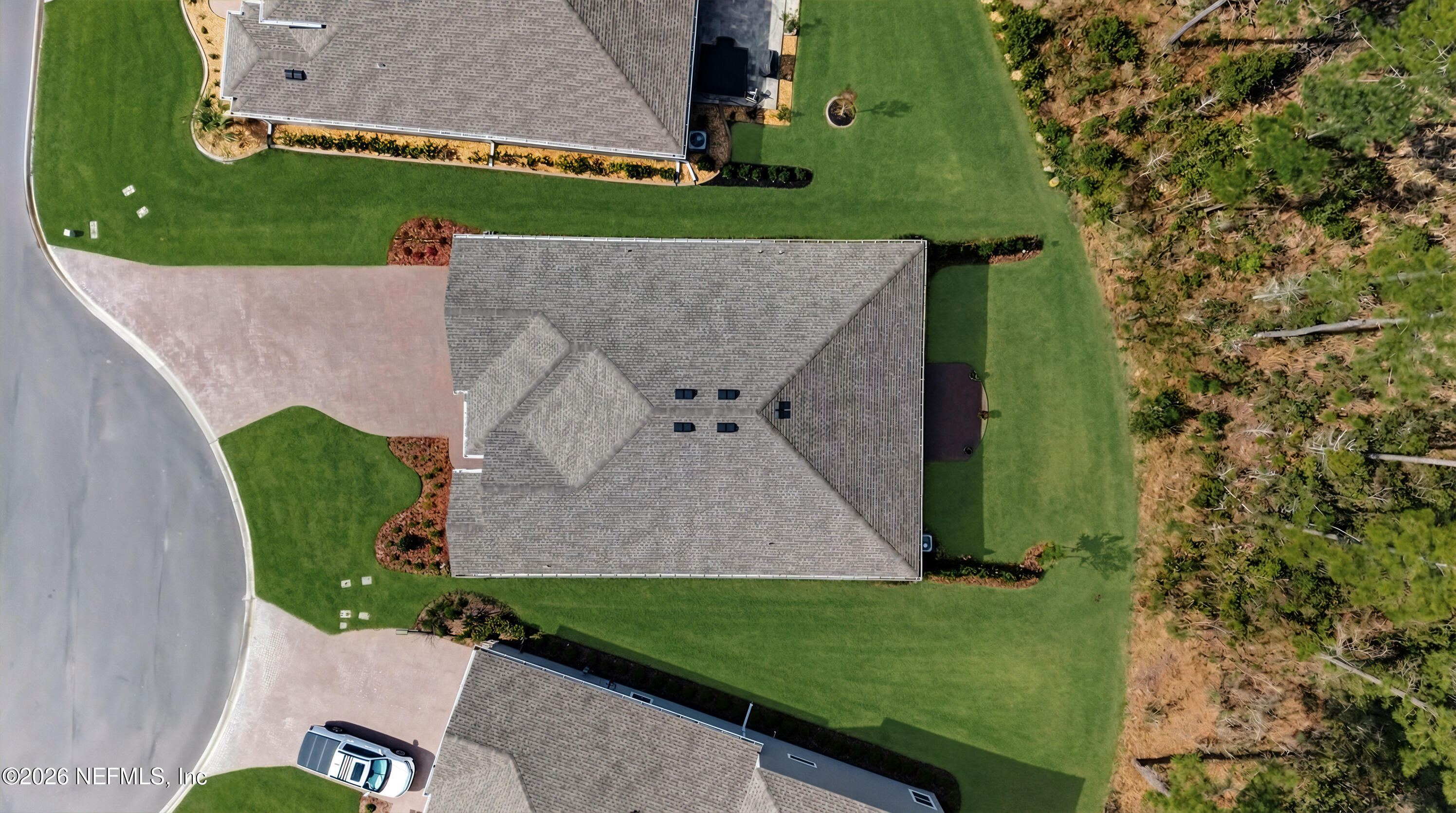 75263 Weathersford Place Yulee, FL 32097 - Photo 77 of 80 an aerial view of a house with a garden and trees