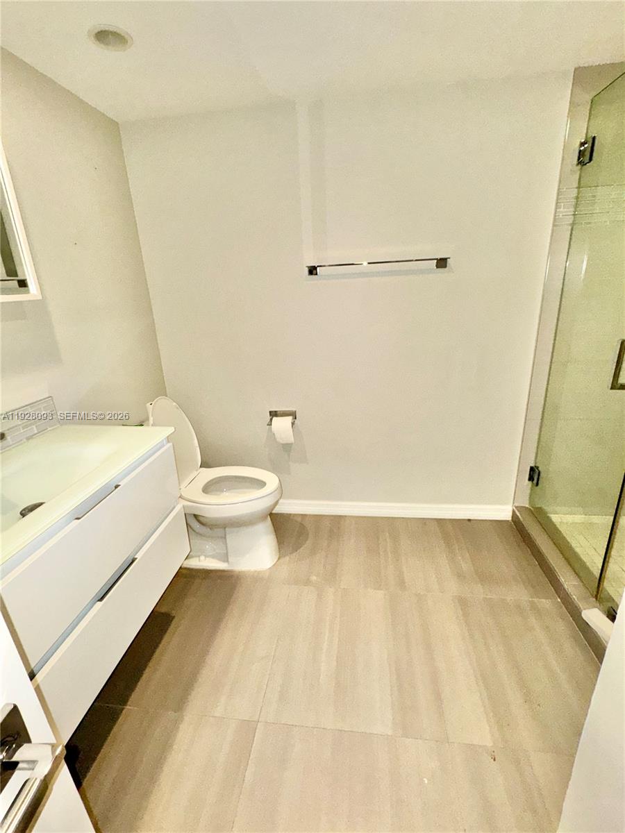 600 Northeast 36th Street, Unit 720 Miami, FL 33137 - Photo 15 of 26 a bathroom with a sink a toilet and a shower
