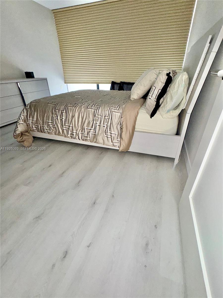 600 Northeast 36th Street, Unit 720 Miami, FL 33137 - Photo 18 of 26 a view of a couch with wooden floor