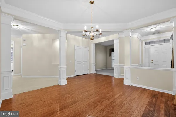 a view of an empty room with a fireplace