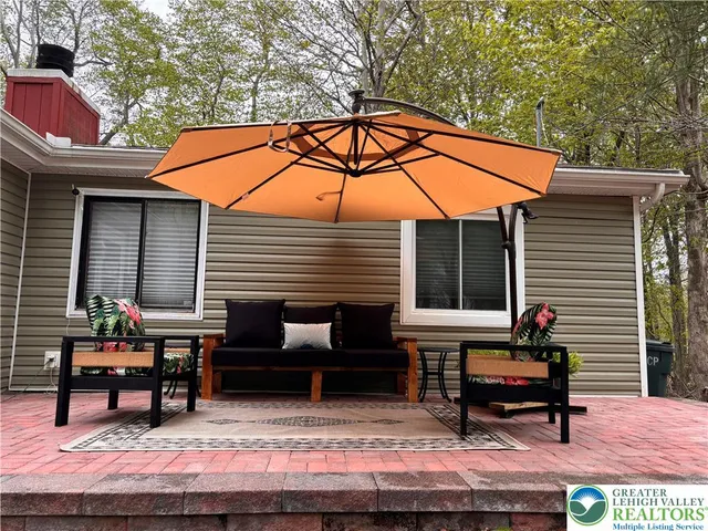 a backyard of a house with seating space