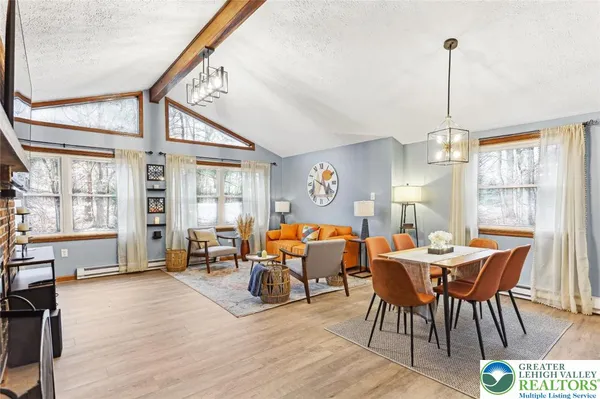 a dining room with furniture window wooden floor