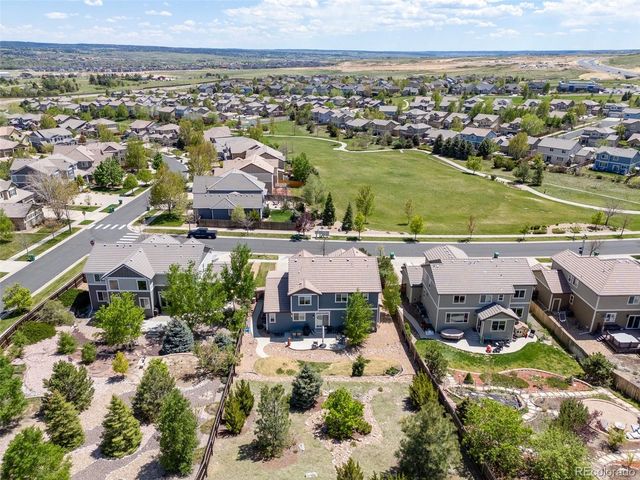an aerial view of a house with a swimming pool