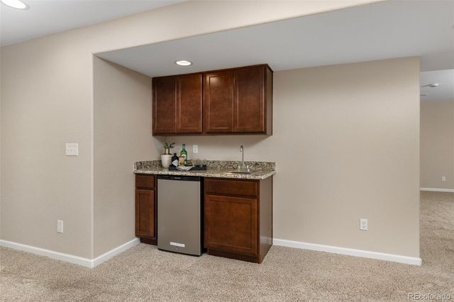 a kitchen with a sink and a stove top oven