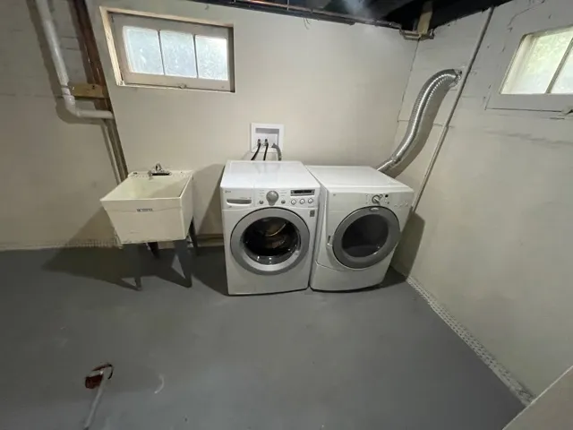 a utility room with dryer and washer