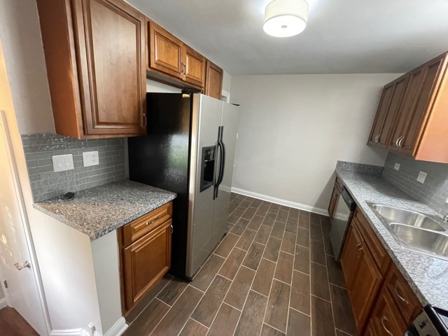 3865 216th Street Matteson, IL 60443 - Photo 3 of 13 a kitchen with a sink stove and refrigerator