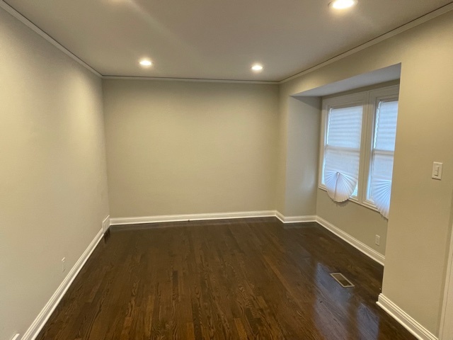 3865 216th Street Matteson, IL 60443 - Photo 5 of 13 an empty room with wooden floor and windows