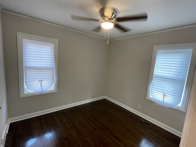 3865 216th Street Matteson, IL 60443 - Photo 8 of 13 an empty room with wooden floor fan and windows