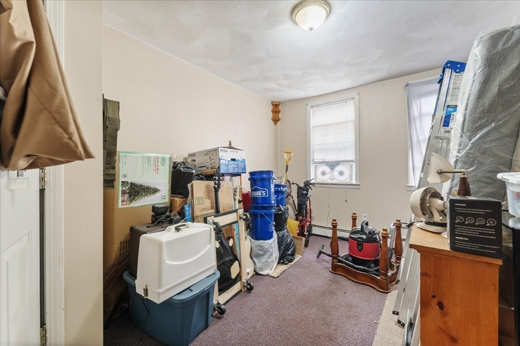 810 Front Street Woonsocket, RI 02895 - Photo 25 of 42 a view of a workspace with furniture and a window